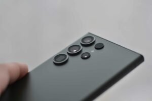 Detailed close-up of smartphone camera lenses, ideal for tech visuals.